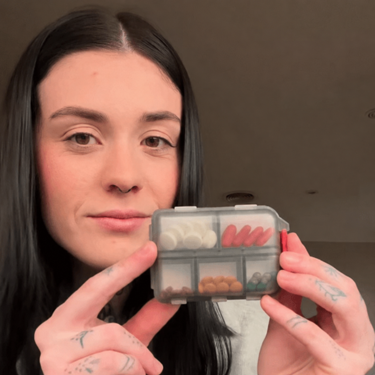 Customer using medication organizer