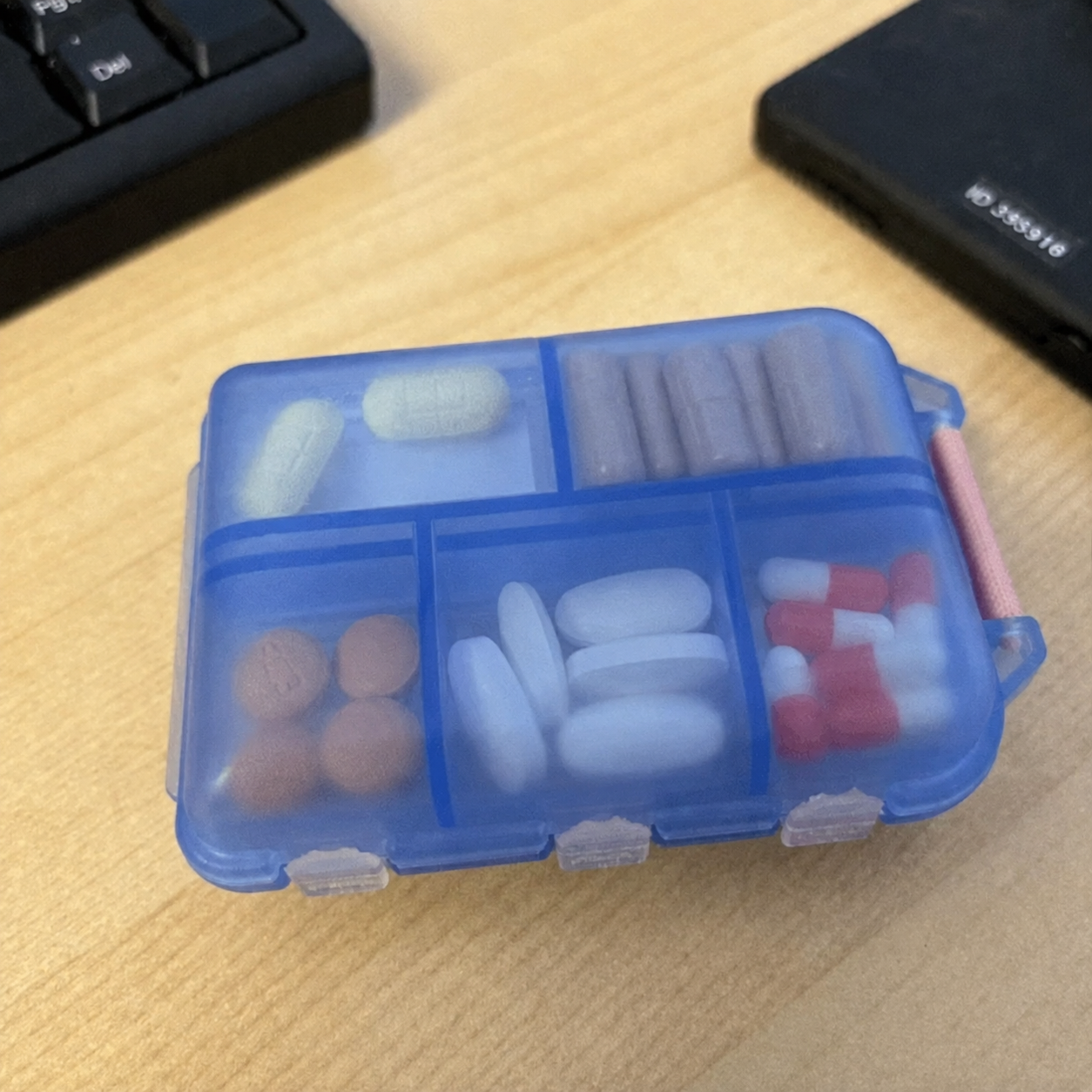 Blue medication organizer without branding